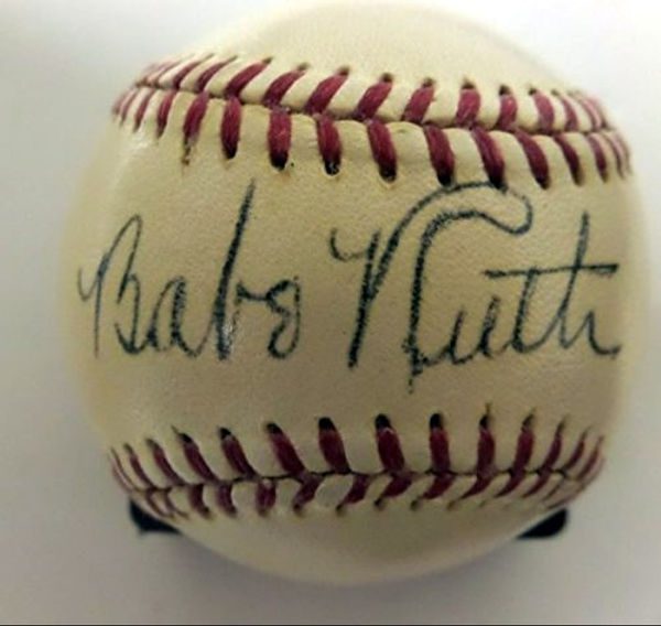 Eye-level view of a vintage baseball glove with a Babe Ruth autograph